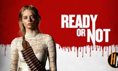 romotional banner for the 2019 horror-comedy film "Ready or Not." A young blonde woman in a torn white lace wedding dress stands against a red background, wearing a bandolier of bullets across her chest. The film's title appears in large white text to her right, with a dripping blood effect along the bottom of the red section.
