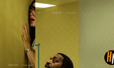 Promotional image for *Backrooms* (A24, in theaters 05.29.26), created by combining three official one-sheet posters into a single widescreen composite. Left panel: a woman with dark hair presses her hand against a yellow-green institutional wall, mouth open in terror, her face partially obscured as she peers around a corner. Center panel: the same yellow-green environment, nearly empty, with a small teal barrier visible — stark and unsettling. Right panel: a man looks upward with a fearful expression against a pale institutional wall. The Horrortainment News logo appears in the lower right corner.