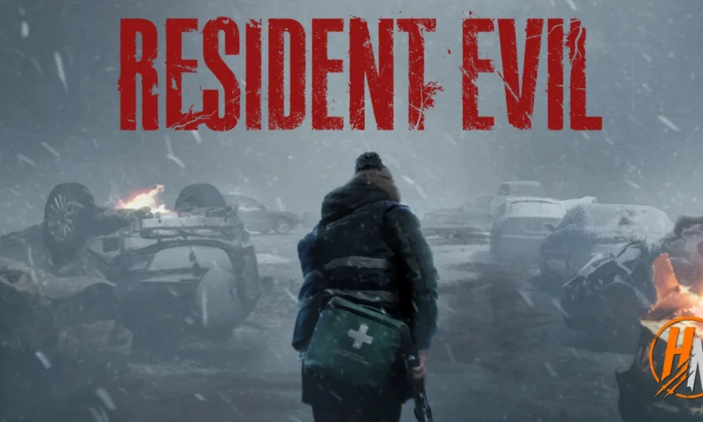 Promotional artwork with the "RESIDENT EVIL" title in distressed red lettering across the top. Below it, a figure seen from behind, wearing a beanie, a dark winter jacket with reflective stripes, and a green first-aid case slung at their side, stands in a heavy snowstorm facing a road littered with wrecked cars. One car lies overturned and burning, and flames burn at the right edge of the frame. A small orange "HN" logo sits in the bottom-right corner.